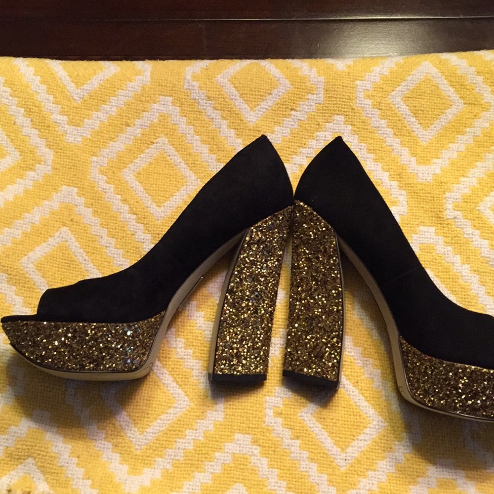 Black and gold platform heels.